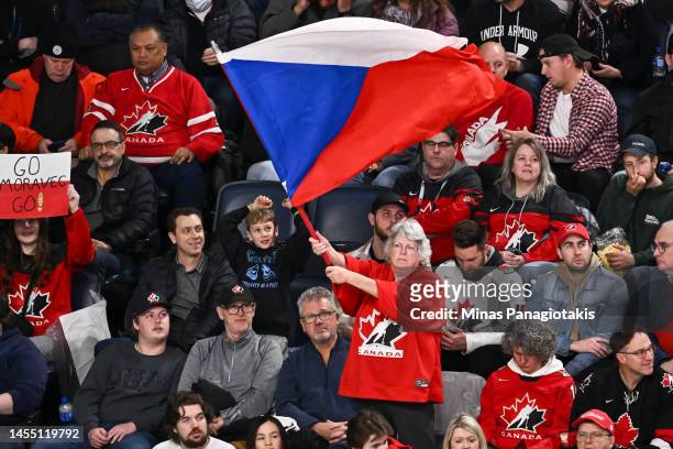 Spectator waves a Czech Republic flag during the second period against Team Sweden in the semifinal round of the 2023 IIHF World Junior Championship...