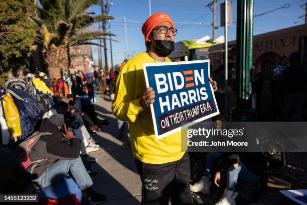 An immigrant rights advocate protests Biden Administration policies while outside a migrant shelter on January 08, 2023 in El Paso, Texas. President...