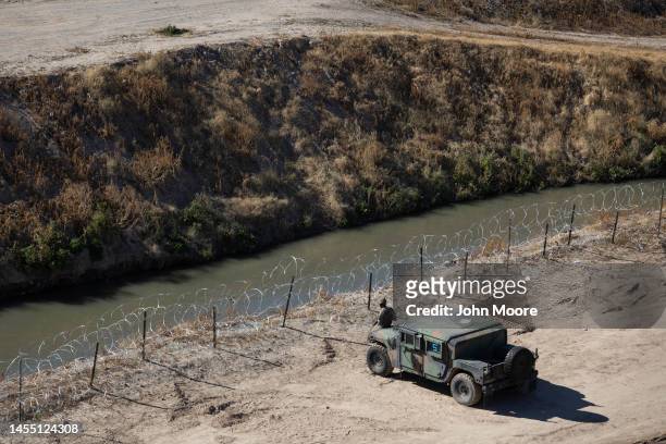 Texas National Guard soldiers guard the U.S.-Mexico border on January 08, 2023 in El Paso, Texas. President Joe Biden visited El Paso Sunday, his...