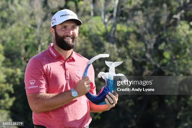 Jon Rahm of Spain celebrates with the trophy after winning during the final round of the Sentry Tournament of Champions at Plantation Course at...