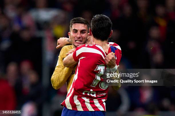 Stefan Savic of Atletico de Madrid fighting with Ferran Torres of FC Barcelona during the LaLiga Santander match between Atletico de Madrid and FC...