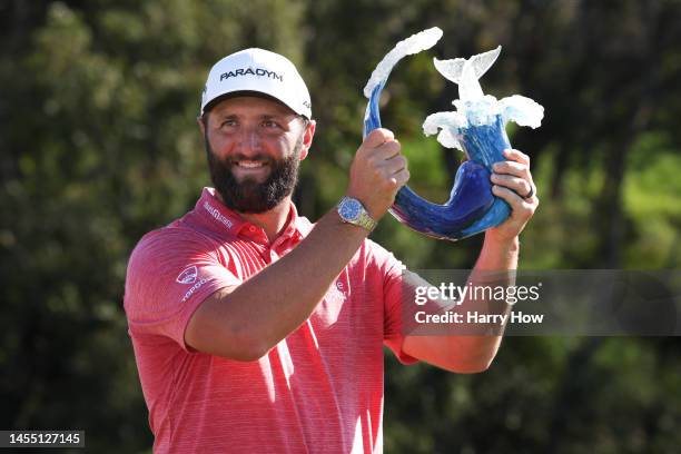 Jon Rahm of Spain celebrates with the trophy after winning during the final round of the Sentry Tournament of Champions at Plantation Course at...