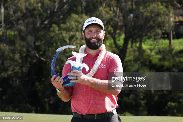 Jon Rahm of Spain celebrates with the trophy after winning during the final round of the Sentry Tournament of Champions at Plantation Course at...