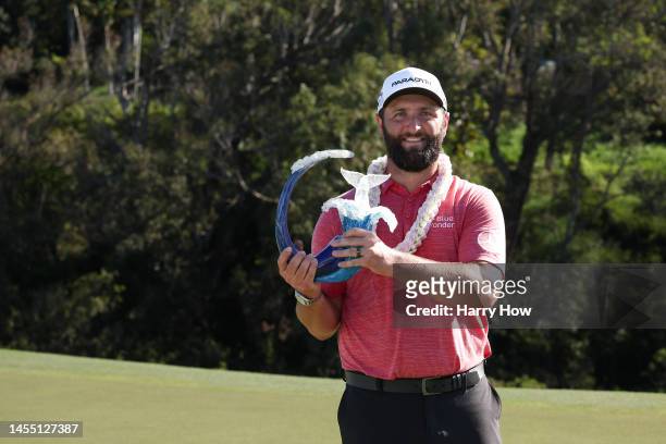 Jon Rahm of Spain celebrates with the trophy after winning during the final round of the Sentry Tournament of Champions at Plantation Course at...
