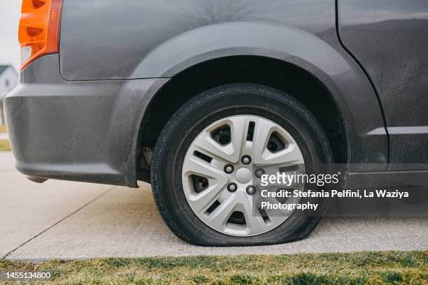 flat tire - deflated stock pictures, royalty-free photos & images