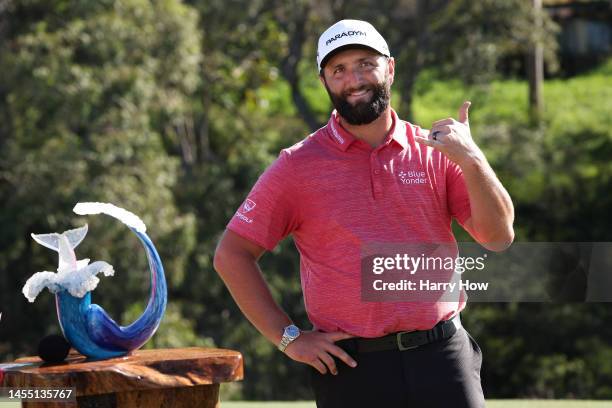 Jon Rahm of Spain celebrates with the trophy after winning during the final round of the Sentry Tournament of Champions at Plantation Course at...