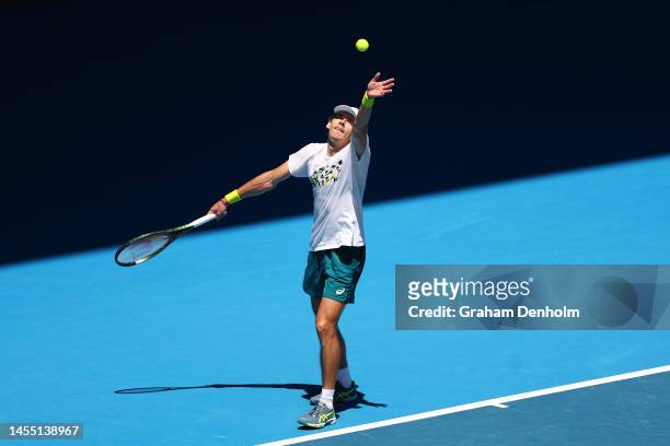 Alex de Minaur of Australia serves during a practice session ahead of the 2023 Australian Open at Melbourne Park on January 09, 2023 in Melbourne,...