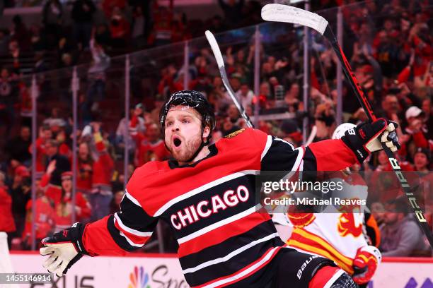 Max Domi of the Chicago Blackhawks celebrates after scoring the game-winning goal in overtime against the Calgary Flames at United Center on January...