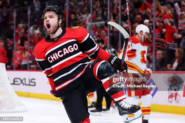 Max Domi of the Chicago Blackhawks celebrates after scoring the game-winning goal in overtime against the Calgary Flames at United Center on January...