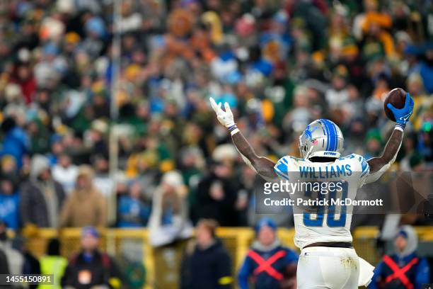 Jamaal Williams of the Detroit Lions celebrates after scoring a touchdown during the fourth quarter against the Green Bay Packers at Lambeau Field on...
