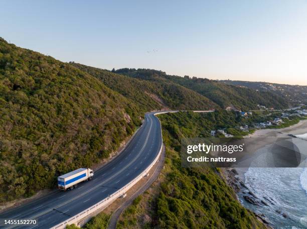 container truck along a scenic road - south africa aerial stock pictures, royalty-free photos & images
