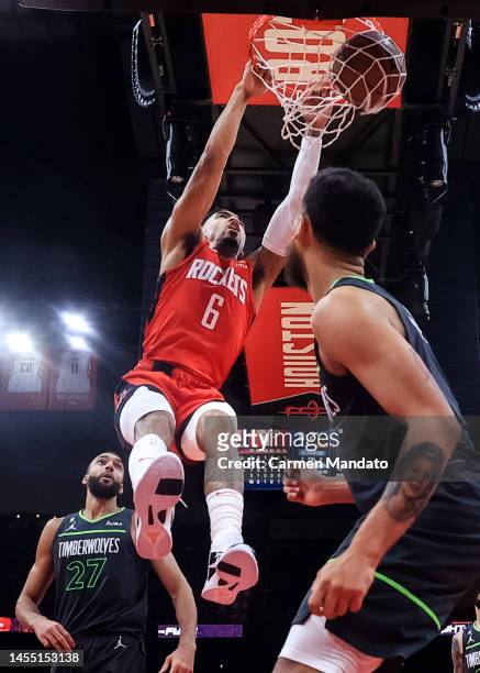 Kenyon Martin Jr. #6 of the Houston Rockets dunks the ball ahead of Rudy Gobert of the Minnesota Timberwolves during the second half at Toyota Center...