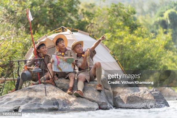 boy scouts team camping at forest - boy scouts of america stock pictures, royalty-free photos & images