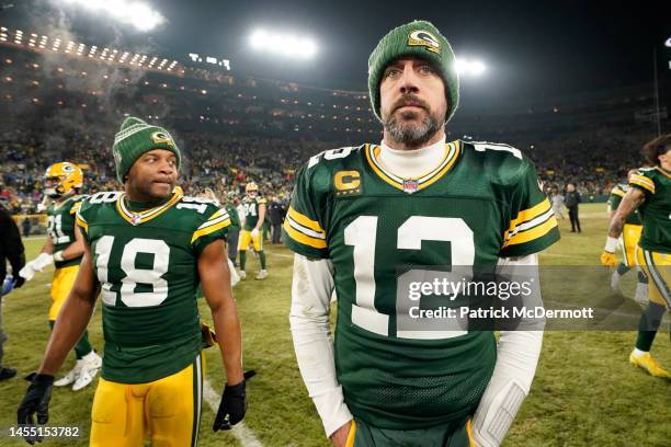 Aaron Rodgers and Randall Cobb of the Green Bay Packers walk off the field after losing to the Detroit Lions at Lambeau Field on January 08, 2023 in...