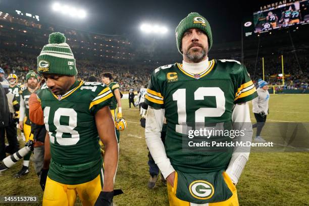 Aaron Rodgers and Randall Cobb of the Green Bay Packers walk off the field after losing to the Detroit Lions at Lambeau Field on January 08, 2023 in...