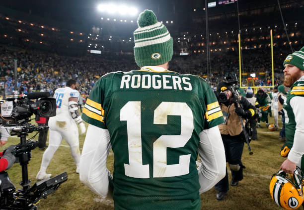 Aaron Rodgers of the Green Bay Packers walks off the field after losing to the Detroit Lions at Lambeau Field on January 08, 2023 in Green Bay,...