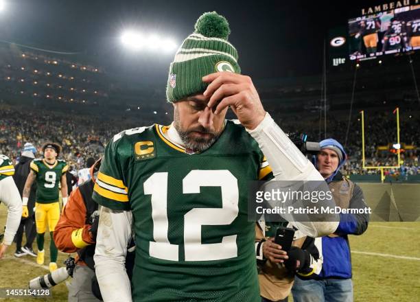 Aaron Rodgers of the Green Bay Packers walks off the field after losing to the Detroit Lions at Lambeau Field on January 08, 2023 in Green Bay,...