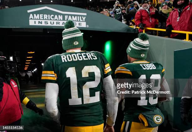 Aaron Rodgers and Randall Cobb of the Green Bay Packers walk off the field after losing to the Detroit Lions at Lambeau Field on January 08, 2023 in...