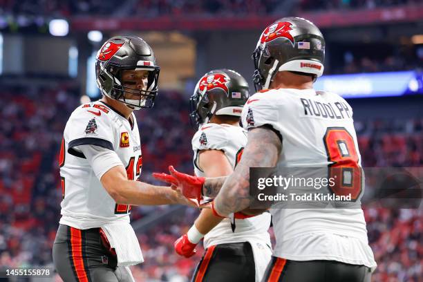 Tom Brady celebrates with Kyle Rudolph of the Tampa Bay Buccaneers after his touchdown during the first half against the Atlanta Falcons at...