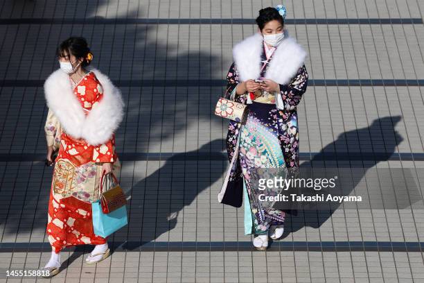 Women wearing kimonos are seen outside of Yokohama Arena on January 09, 2023 in Yokohama, Japan. For about 140 years, the age of adulthood in Japan...