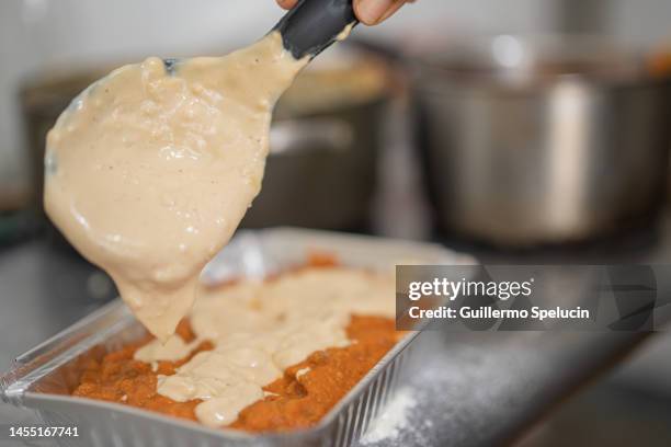 preparing lasagna - cheese sauce stock pictures, royalty-free photos & images