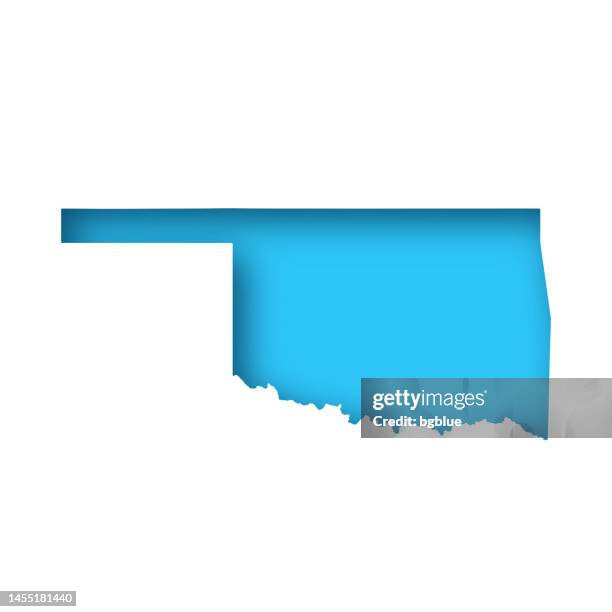 bildbanksillustrationer, clip art samt tecknat material och ikoner med oklahoma map - white paper cut out on blue background - oklahoma