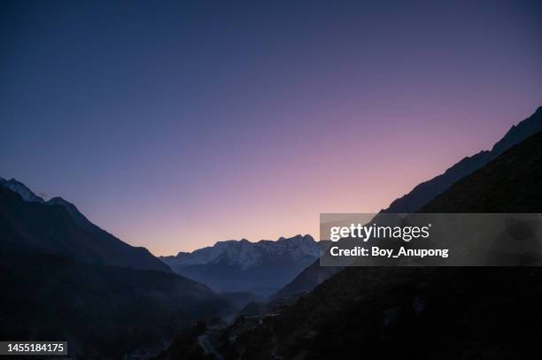 twilight sky of the day in rural nepal. - see through globe stock pictures, royalty-free photos & images