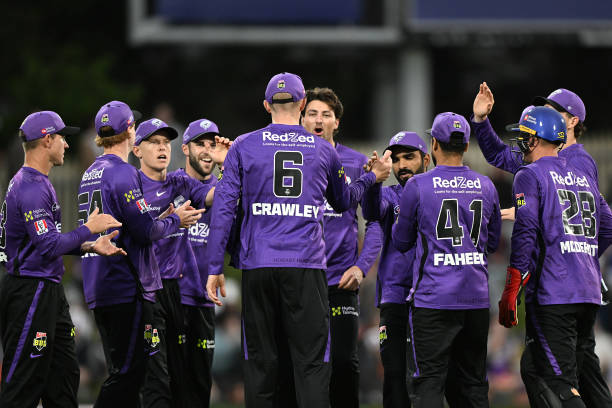 Zak Crawley of the Hurricanes is congratulated on the run out of Joe Clarke of the Stars during the Men's Big Bash League match between the Hobart...