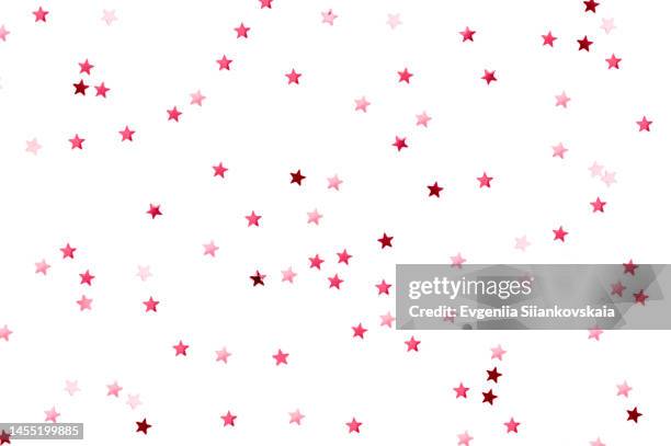 top view of viva magenta star shape confetti isolated on white background. - star confetti white background stockfoto's en -beelden