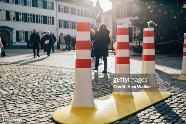colourful bollards in pedestrian area of basel, switzerland - bollards fotografías e imágenes de stock