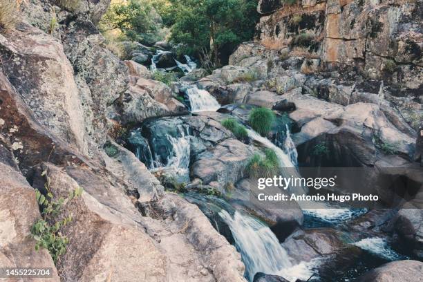 devil's waterfall in extremadura, spain. river and cascade. - hell stock pictures, royalty-free photos & images