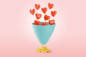 Hearts fall into the sales funnel as a symbol of preferences, which bring coins as a symbol of profit. 3d render