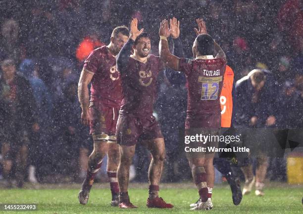 Ben Curry and Manu Tuilagi of Sale Shaks celebrate winning the Gallagher Premiership Rugby match between Harlequins and Sale Sharks at The Stoop on...