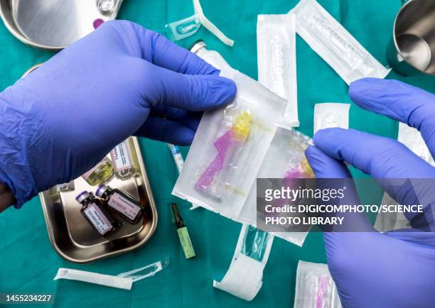 nurse preparing hospital medication, conceptual image - injecting iv stock pictures, royalty-free photos & images