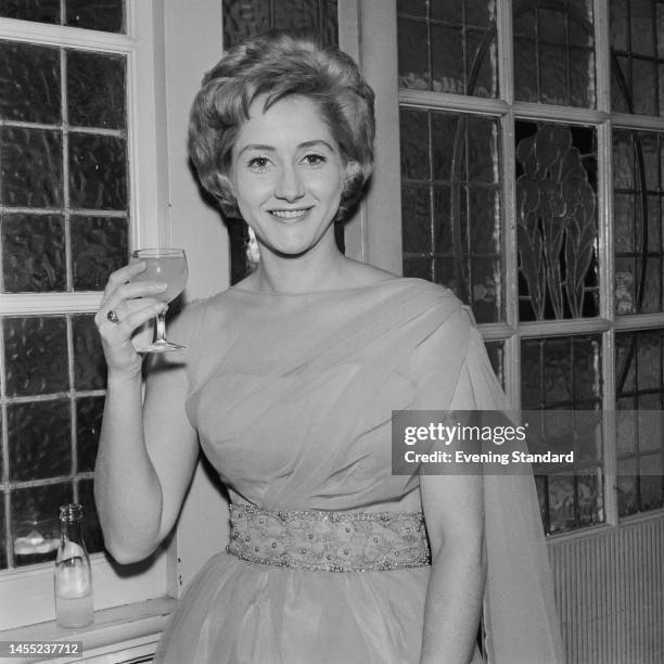 British actress Liz Fraser attending an event on October 30th, 1961.