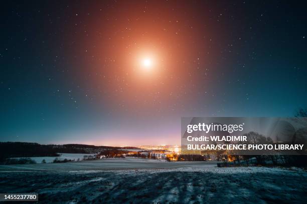 winter landscape at night - ufo stockfoto's en -beelden