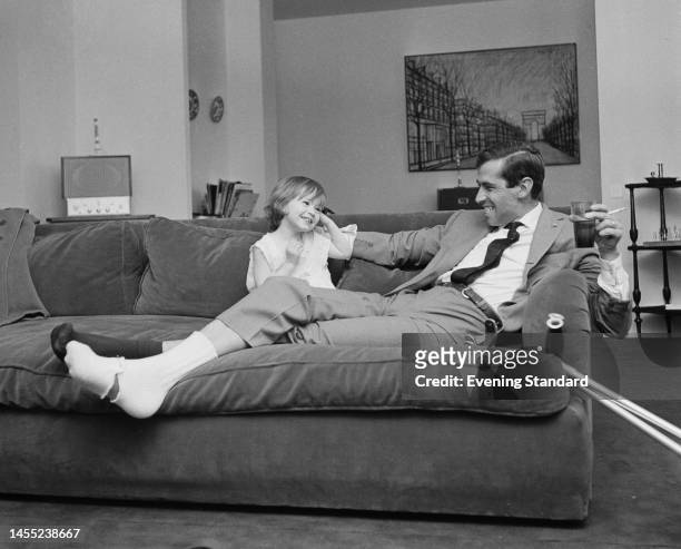 French film director Roger Vadim resting a broken ankle at home with daughter Nathalie on August 30th, 1960. Vadim broke his right ankle during a...