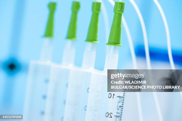 microdispenser in microfluidics lab - cell microarray stock pictures, royalty-free photos & images