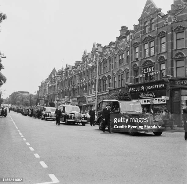 The funeral procession of Harry Pollitt , former General Secretary of the Communist Party of Great Britain, moving through the London suburb of...