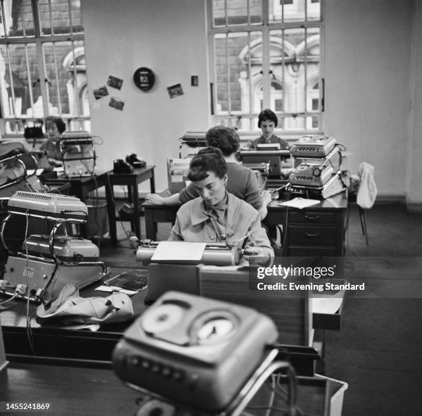 Women at work in a typing pool at Shell Mex House on the Strand, London, on October 3rd, 1960. The building is the London headquarters of Shell Mex...