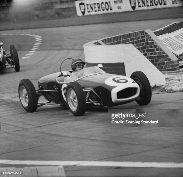 British racing driver Jim Clark competing in the BARC Formula Junior race at Goodwood circuit in Sussex on August 20th, 1960. He is driving a Lotus...