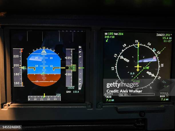 instrument screens in cockpit, flight deck, of a commercial aircraft. - aeroplane dashboard stock pictures, royalty-free photos & images