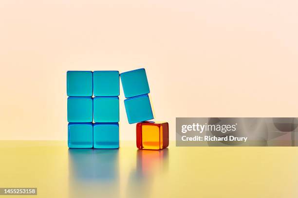 conceptual image of transparent coloured cubes - faiblesse photos et images de collection