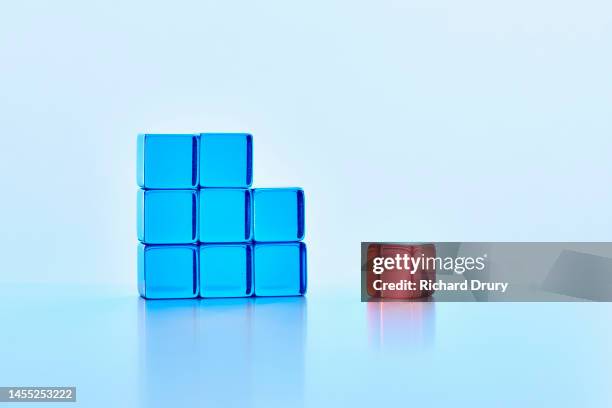 conceptual image of transparent coloured cubes - closing gap stock pictures, royalty-free photos & images