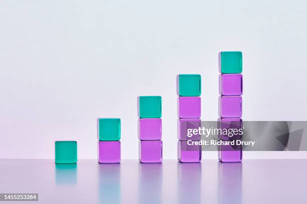 conceptual image of transparent coloured cubes - society economic growth development stock pictures, royalty-free photos & images