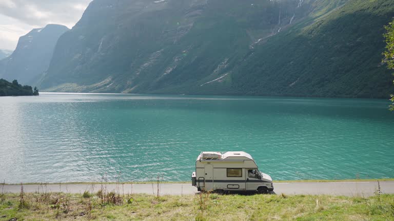 https://media.gettyimages.com/id/1455262570/video/scenic-view-of-camper-van-on-road-in-norway.jpg?b=1&s=640x640&k=20&c=bnWIcIFm6NJA4JopswUMfHGNQisaMdEfzTc3LyIM2dU=