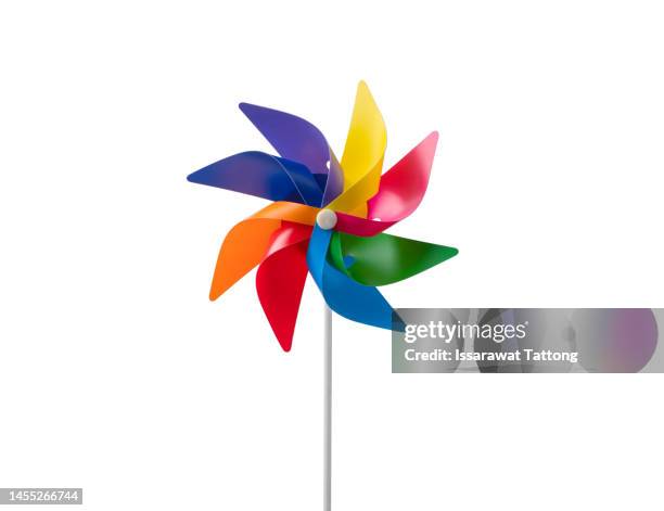 children`s colorful toy wind turbine isolated on white background - moinho de papel - fotografias e filmes do acervo