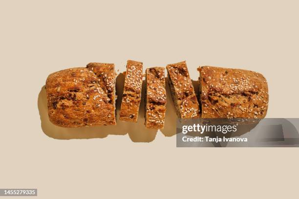 sliced bread on beige background. flat lay, top view, copy space - pane a lievito naturale foto e immagini stock