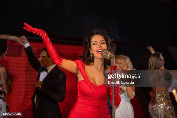 beautiful female singer performing on stage with dancers - the sound of the netherlands event and live performances stock pictures, royalty-free photos & images