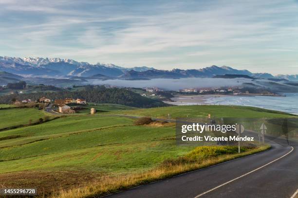 road along the cantabrian coast - lastres stock pictures, royalty-free photos & images